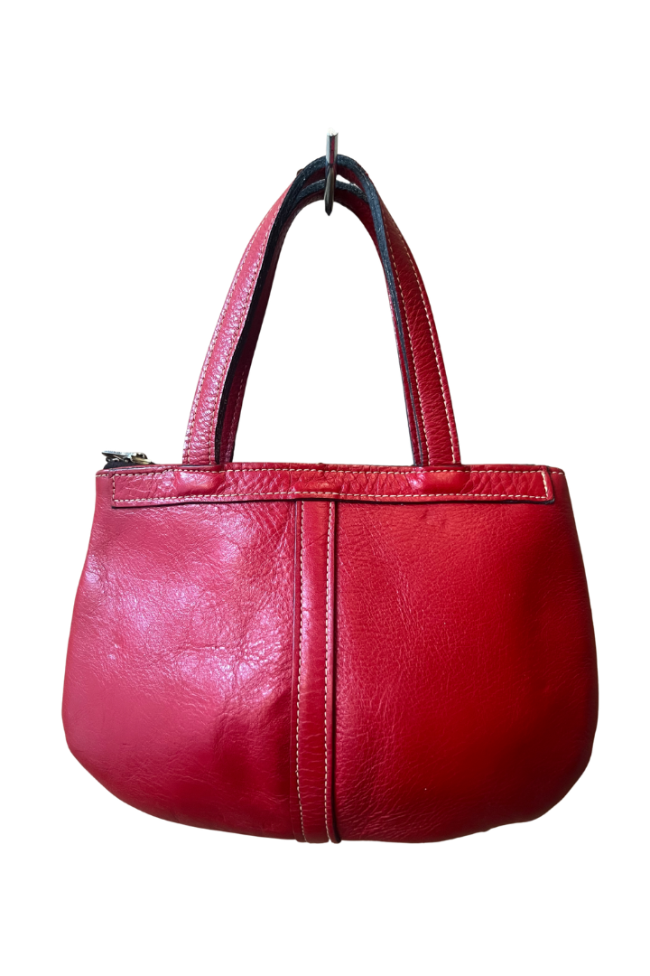 A red leather handbag with two top handles, shown against a plain white background.