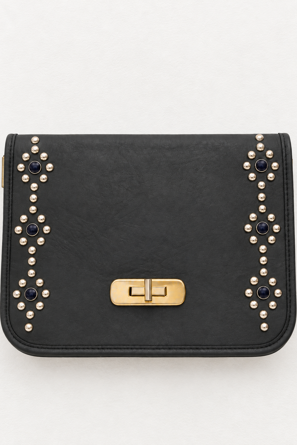 A black faux-leather clutch bag with a gold-tone turn-lock clasp, decorated with rows of gold studs and dark blue rhinestones on the front flap, shown against a plain white background.